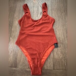 4th & Reckless madeline ring detail swimsuit in rust crinkle. Size XL